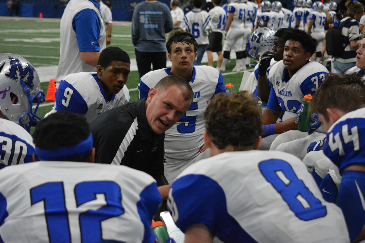 Newly appointed head coach and athletic director Thomas Gammerdinger coaches up his defensive players during the Calallen game. Photo by Dave Winter.