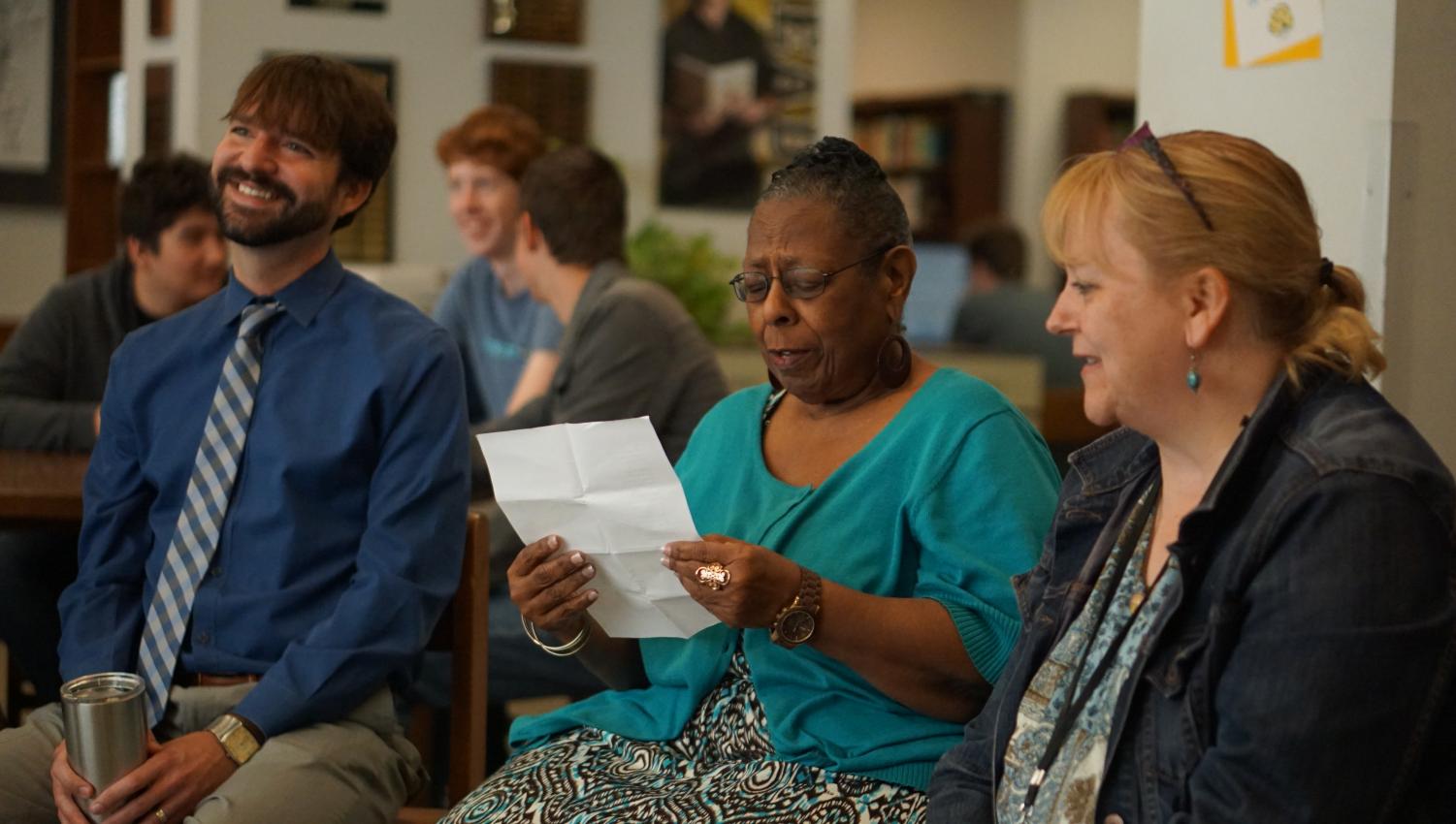 Ms. Jackson and Ms. Rogers read a series of angry haikus which earned the approval of audience members including Mr. Stanchos. Photo by Dave Winter.