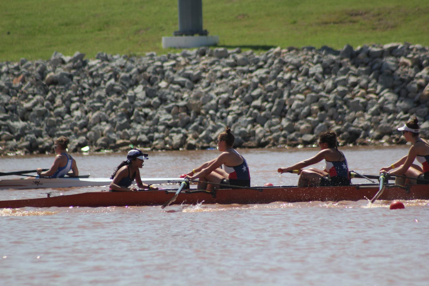 Senior Kate Knifton and her varsity eight pull ahead of Austin Rowing Center in the last 500 meters of the race. Knifton's eight finished second in the race, eight seconds behind first place, but seven seconds in front of third, thus qualifying for Youth Nationals. Photo by Sarah Slaten.