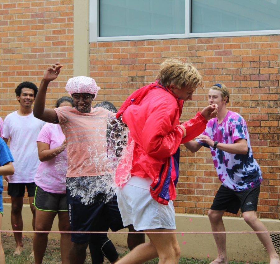 Senior David Ruwwe takes a water balloon to the back during the PALS annual Pink Week fundraiser Peg-a-PAL. The PALS raised over $1,200 for Breast Cancer research. Photo by Rylie Jones.