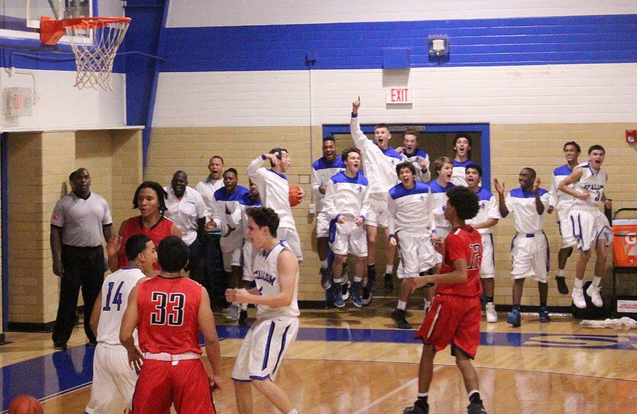 HALL OF FAME: The varsity basketball team erupts in cheering just after Kenneth Hall sank the game-winning layup with seconds left on the clock to break a 55-55 tie and send the JV basketball team to a season-opening two-point win over Del Valle Tuesday night. Both the JV and the varsity squads celebrated at midcourt immediately after the buzzer sounded. I didnt think about the time at all, Hall said afterward. I just did what I had to do. Photo by Elin Campana Wadman.