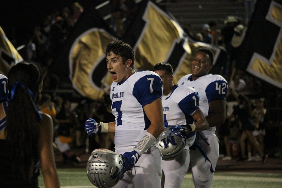 Linebacker Jack Switzer, running back Alexander Julian and defensive end Kevon Walton celebrate just after the clock runs out on McCallums 31-24 road victory over Seguin at Matador Stadium. Photo by Adrian Peña.