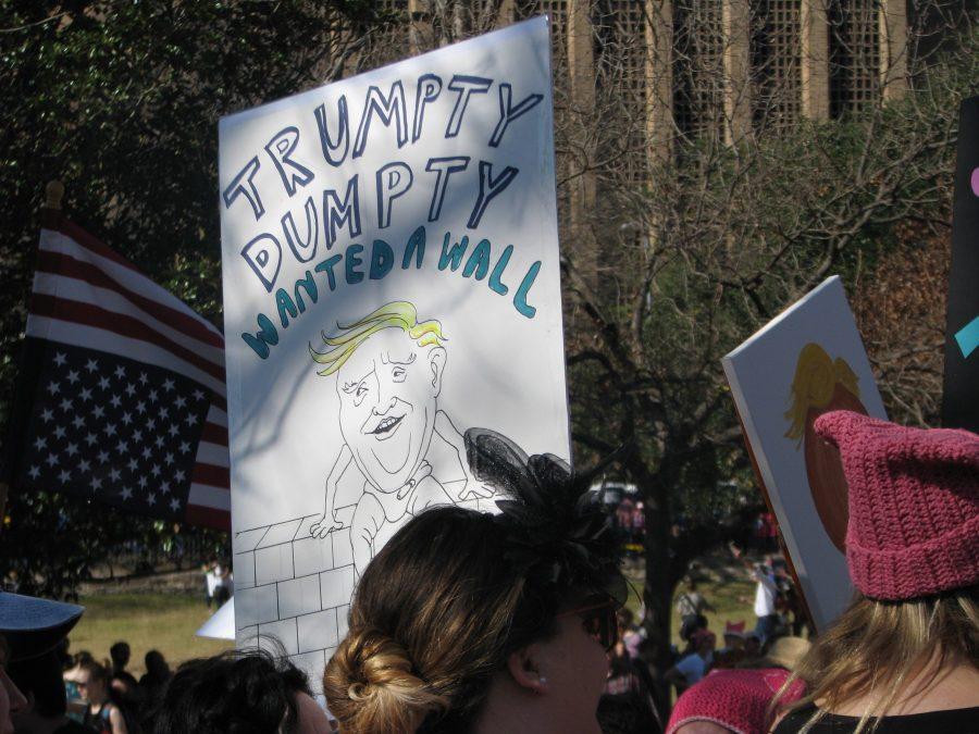 A protest sign at the Austin March for Women on Jan. 21 mocks President Trumps proposal to build a border wall to prevent illegal immigration from Mexico to the United States. Photo by Sophie Ryland.