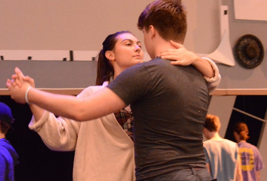 Junior Sophia Mullican and  freshman Magnus Bowles dance together for their roles of Paula and Frank Sr. who are Frank Jrs parents. Photo by Jasmine Barrera.