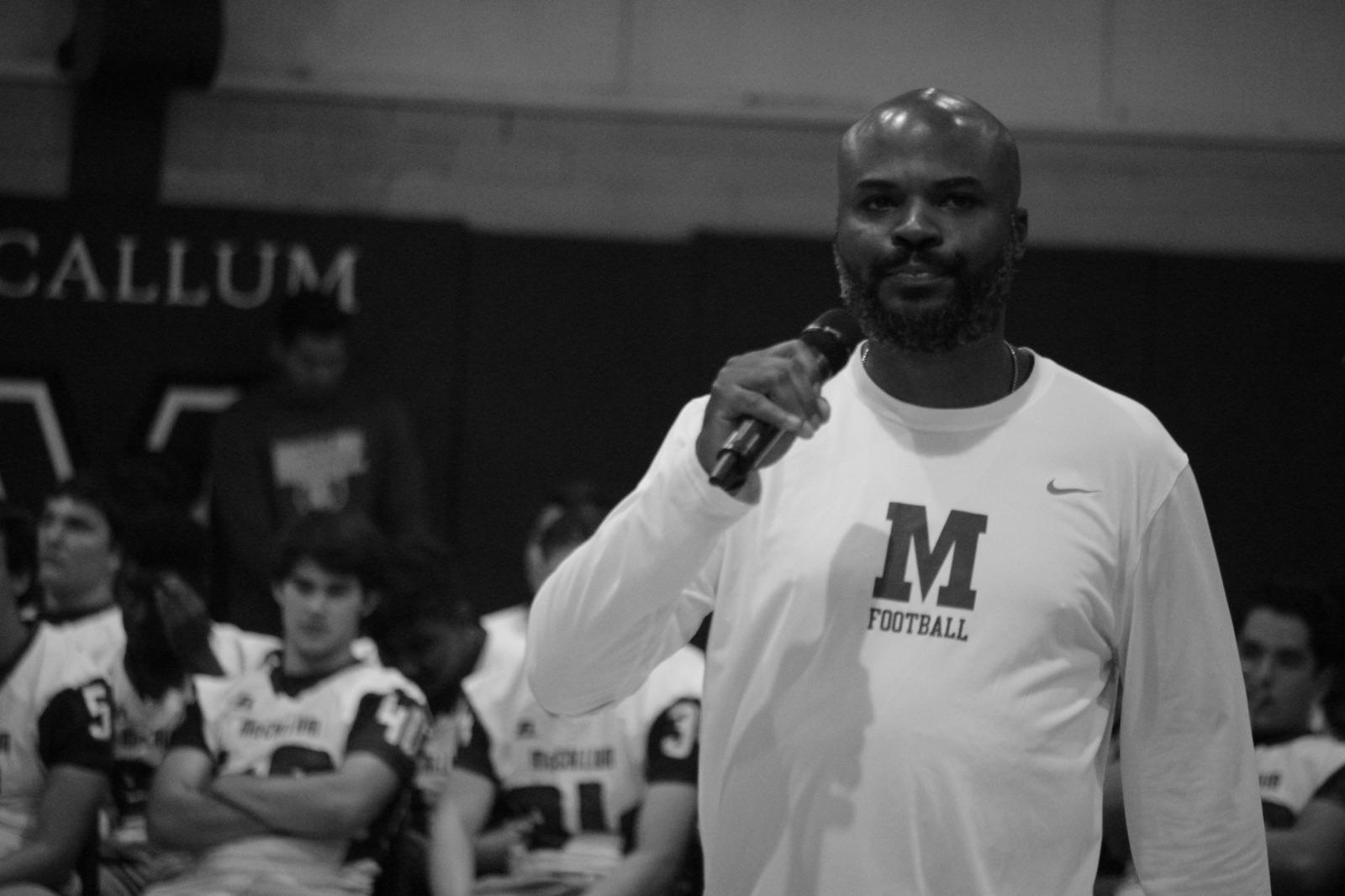 Coach Taylor speaks to the student body at the Pink Week/Battle of the Bell pep rally on Friday, Oct. 13 before his team walloped Travis, 72-0. Photo by Joseph Cardenas.