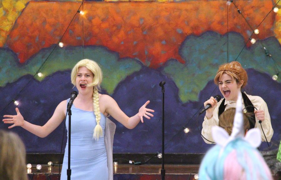 Queen Elsa (sophomore Maryanna Tollemache) and Princess Anna (sophomore Lilah Guaragna)  belt out “For The First Time In Forever” from Disney’s ‘Frozen’ during Saturday’s Princess. The event functioned as a fundraiser for MACtheatre. “I think the event went really well!” said Maryanna Tollemache, “We raised up money for our theatre program in a way that while also benefitting us, benefit the kids in our community by letting them see their favorite princes and princesses! It affected MACtheatre as we have more funds that will help us produce even higher quality shows!” The pair performed along with many other MACtheatre students, all dressed-up as Disney princesses and princes.