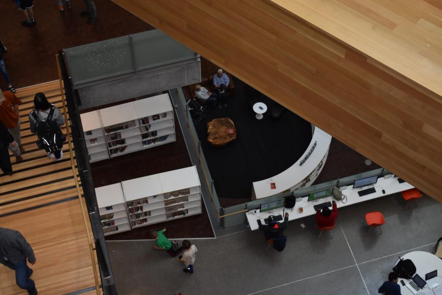Thanks to the librarys open concept, you can see the bottom floor from the seventh and top floor.  The open concept also makes the library environmentally friendly because with the natural light there is less need for artificial lights, which saves power. Photo by Olivia Watts.