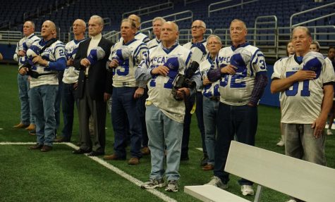 Members of the 1966 team stand for the national anthem before the 2017 Knights defeated the Alice Coyotes, 33-8, in the Region IV semifinal game in the Alamodome. The victory avenged the 16-12 loss at the hands of Alice that ended the Knights 1966 season. Photo by Dave Winter.