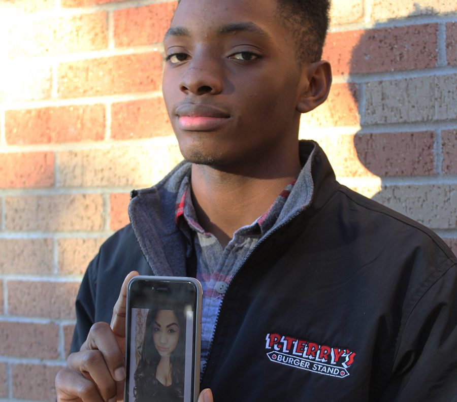 Senior Josh Brown displays a cellphone link to the GoFundMe page to raise money for the funeral expenses of car crash victim Ashley Martinez. Photo by Lily McCormick.