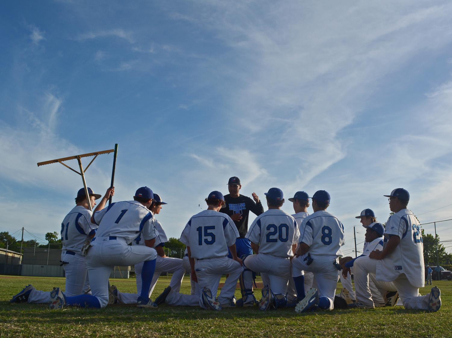 Coach Alvarez gives the final postgame speech of the season to the JV Knight squad after it defeated Reagan in the final game of the season at Mac. The Alvarez era begins with two Friday games versus Wimberley and Burnet. Photo by Dave Winter.