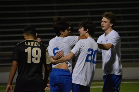 The Knights celebrate Marcel Lopez-Reeds goal, which helped them earn a 2-2 draw Tuesday night at House Park. The result extended the varsitys undefeated streak to eight games. Photo by Isaias Cruz.