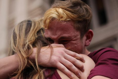 Marjory Stoneman Douglas High senior Jack Haimowitz shares an embrace after his emotional speech at today's #marchforourlives at the Texas Capitol in downtown Austin. Haimowitz spoke of the awful Feb. 14 shooting on his campus. "What took place on Valentine's Day not only stripped the students of Douglas of their innocence, but it brutally ripped 17 lives from their homes." He also spoke of the resolve he and his classmates and have found since the shooting. "We are the change we never knew we needed, and we have found the strength that we never knew we were looking for. ... Every day I see people not only wishing for change but refusing to accept anything else." He also pleaded with the audience for unity. "If we ever wish to fully overcome the hatred and fear of a scale such as this, we must unite as Americans regardless of the societal, racial and physical constructs put in place to hinder our unification." Photo by Madison Olsen.