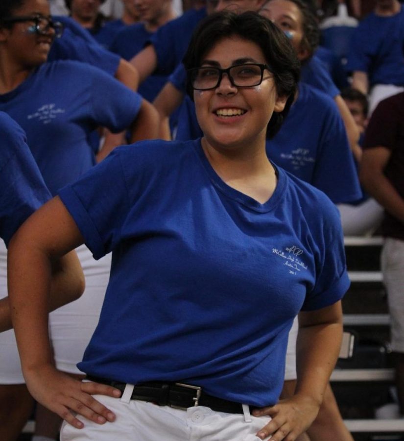 Senior Aly Candelas dances with the marching band during the Taco Shack Bowl. Photo by Madison Olsen. 