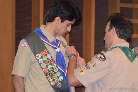 Trinity University freshman Nikhil Joyce (Mac Class of 2017) receives his Eagle pin at the Eagle Scout Court of Honor he shared with five other longtime Troop 410 scout mates. Photo courtesy of Marc Vandament.