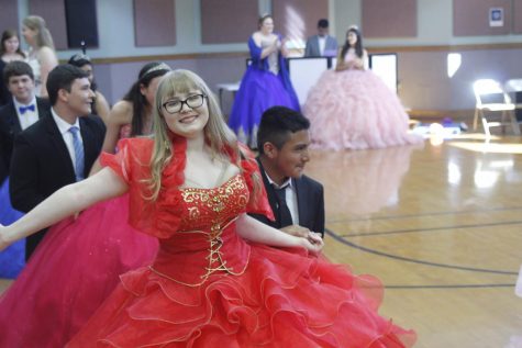 Sophomores Lucy Smith and Richard Hernandez dance at the McCallum High School Ballet Folklórico Quinceañera tonight. Of the 16 McCallum girls who participated in the event, some had never had a quinceañera, some were celebrating their quinceañera for a second time, and four were celebrating their real quinceañeras. The quinceañera started with a dance routine that the 16 girls and their partners practiced everyday at lunch for two weeks and was followed by lots of food, music and more dancing. McCallum Spanish teacher, Juana Gun, coordinated the event for the third straight year in order to give McCallum girls a chance to participate in the Latino cultural celebration. "This started when one of my Ballet Folklorico girls said, 'Mrs. Gun, did you have a quinceañera?' and I said, 'No, my family couldn't afford it,'" Gun said. "So, we brainstormed how we could have a McCallum High School quinceañera for people that wanted to be in it." Photo and reporting by Steven Tibbetts. 