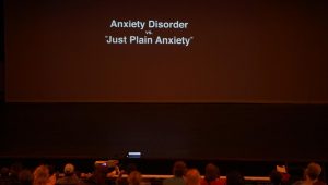 McCallum High School students and their families watch Angst, an informative short film about the affects of anxiety disorders on youth. The film was screened at 6:00 Monday,  May 7 in the MAC as a way to observe Mental Health Awareness Month. Photo by Steven Tibbetts.
