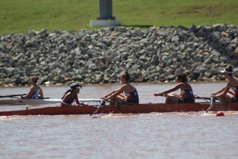 Senior Kate Knifton and her varsity eight pull ahead of Austin Rowing Center in the last 500 meters of the race. Knifton's eight finished second in the race, eight seconds behind first place, but seven seconds in front of third, thus qualifying for Youth Nationals. Photo by Sarah Slaten.