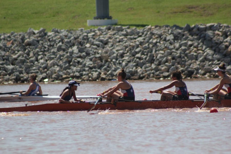 Senior Kate Knifton and her varsity eight pull ahead of Austin Rowing Center in the last 500 meters of the race. Kniftons eight finished second in the race, eight seconds behind first place, but seven seconds in front of third, thus qualifying for Youth Nationals. Photo by Sarah Slaten.