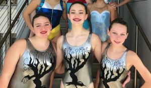 Pearl Heinley (front row center) poses with her team after competing at Youth Synchronized Swimming Nationals April 12-15 at the Westside Aquatic Center in Lewisville. Photo courtesy of Heinley.