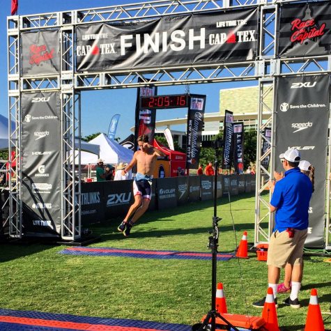 Clennan crosses the finish line at CapTex triathlon in downtown Austin on Memorial Day. "It's always downtown and it's always a great Memorial Day," Clennan said. "Its highlight is you get to race to the Capitol on your bike." Clennan took third place in the men's overall competition at the race. Photo courtesy of Clennan.