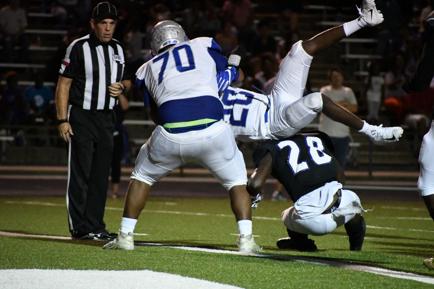 With an little help from offensive lineman Alvino Carbajal, Deron Gage wedged his way into the end zone to make the score 28-7 in the second quarter. Photo by Bella Russo.