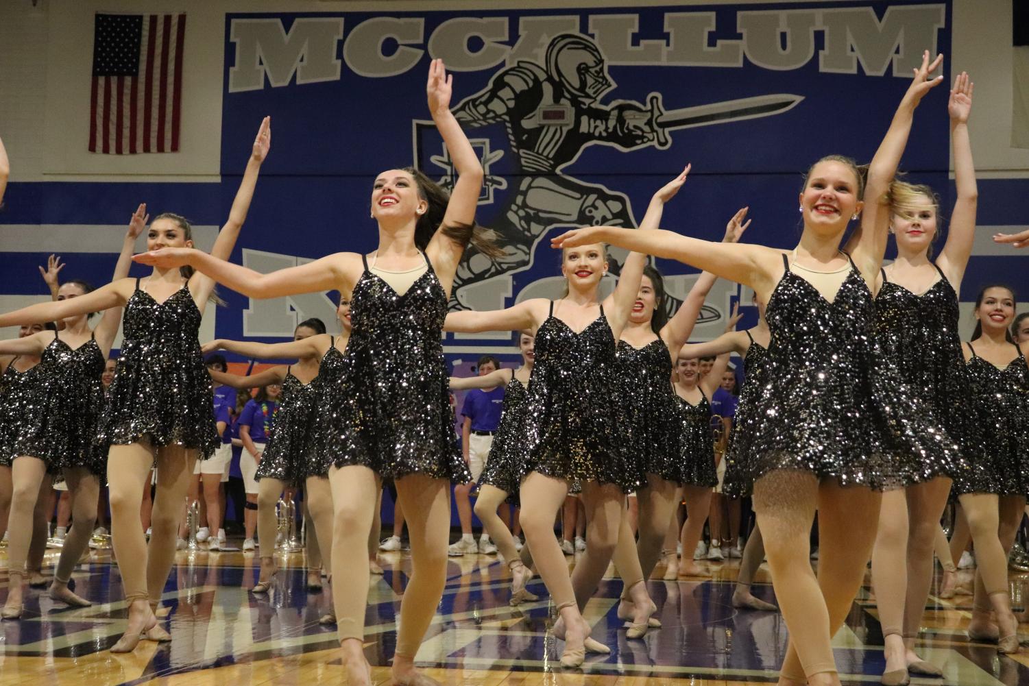 The Blue Brigade performs during the Taco Shack pep rally on Aug. 30 in the large gym. Photo by Gabby Sherwood.