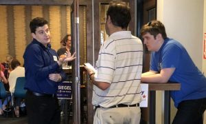 School board candidate Zachary Price meets with community members at his Brewtorium campaign event. Im not running away from the fact that Im young, Price said. His opponent, Kristin Ashy, 44, has the endorsement of current District 4 Trustee Julie Cowan.