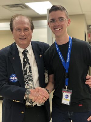 Senior Florian Krentzel with Jerry Wooddfill, an Apollo Program spacecraft warning system engineer.  “He was super cool,” Krentzel said. “He sang songs to us and showed us a clip from the movie, Apollo 13, where the system he worked on was recreated for Tom Hanks to use.”  Photo courtesy of Florian Krentzel. 