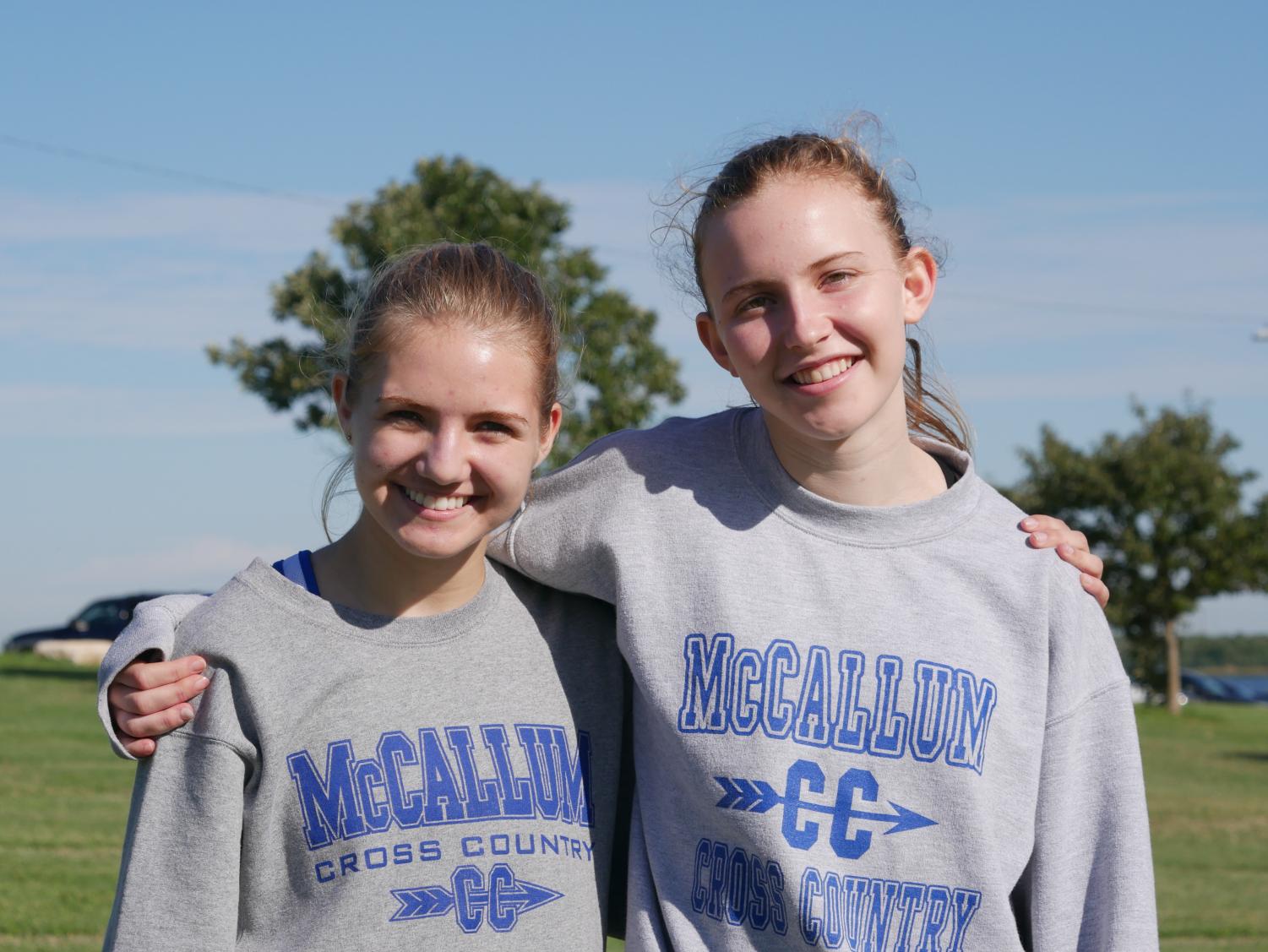 Senior co-captains Piper Wiest and Marianna Vandenbout pose for a picture in front of Decker Lake, the same location where they first became friends three years prior. Photo by Kristen Tibbetts.