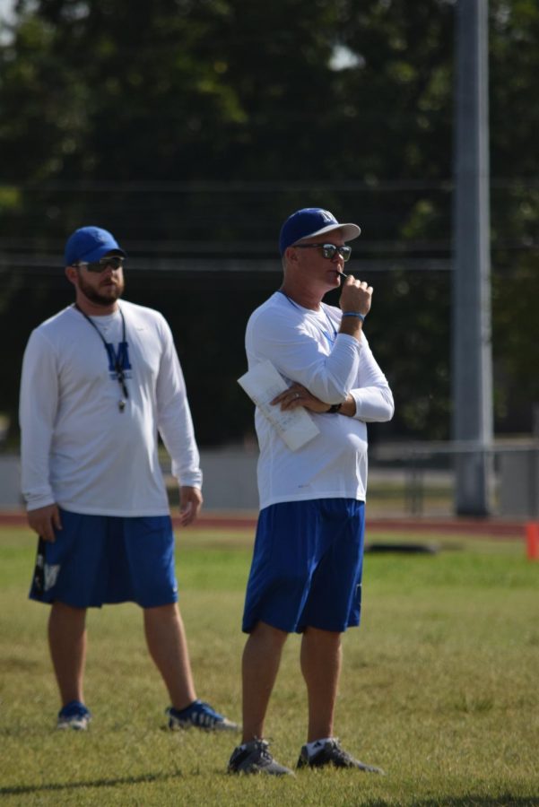 Searle, right, coached baseball last season at Lago Vista with new varsity baseball coach Brandon Grant, left. Both also coached football as shown here at the Blue-Gray Scrimmage to kick off the football season. 
