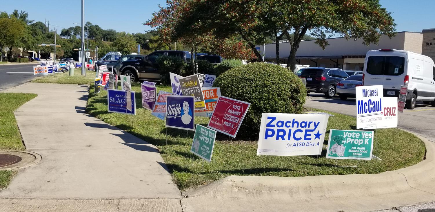 During early voting, a motley mosaic of political signs borders the sidewalk leading to the Old Quarry Library at 7051 Village Center Drive.
