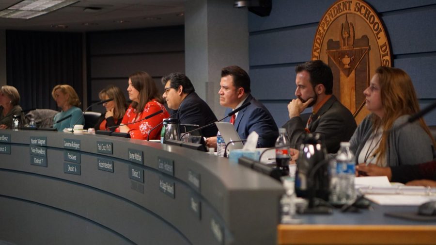 At the Austin ISD Board of Trustees meeting on Nov. 26, board members (from left to right), Ann Teich, Kristin Ashy, Amber Elenz, vice president Yasmin Wagner, president Geronimo M. Rodriguez Jr., Superintendent Paul Cruz, Jayme Mathias, Cindy Anderson, and LaTisha Anderson (not pictured) listen to community members as they discuss district problems and policies, propose ideas, and give thanks to outgoing board members, former secretary Julie Cowan and Edmund T. Gordon. Photo by Elisha Scott.