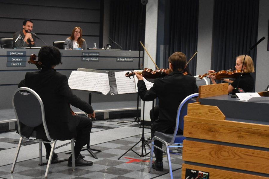 Four McCallum orchestra freshmen play a piece for members of the Austin ISD Board of Trustees during yesterday evenings board meeting. Photo by Olivia Watts.