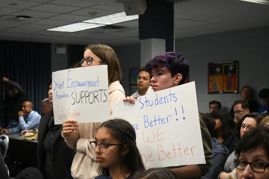 Members of the Student Empowerment Association hold signs rejecting the proposed 2019 budget cuts. Photo by Elisha Scott.