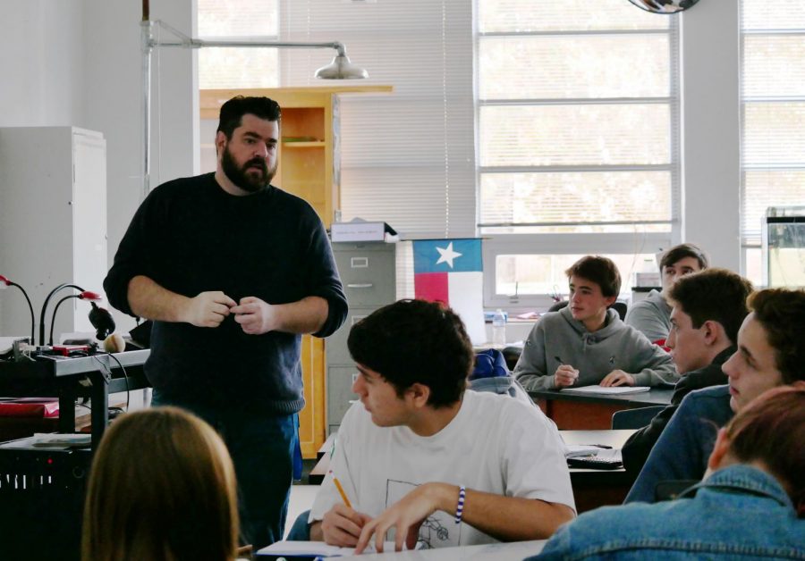 Koslan gives a lecture to his AP Physics 1 class about momentum. Koslan loved chemistry as a student, but grew to love physics when he became a teacher.