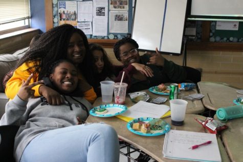 Four close friends in AVID smile at the camera. All of them are relaxed and happy that their final is to eat and watch a movie. ”I have such a strong bond with these girls I consider them like a second family to me,” Savannah said.
