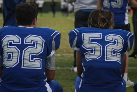 Gavin Freedman and Johan Holmes take a rare sideline break on the bench during the freshmen teams 60-6 win over Lanier on Oct. 11 at Nelson Field. About the only way to get the duo off the field is for there to be a blowout. The two were standout freshman players on both the offensive line and on defense, and they were key components of an award-winning drum line in marching band. Photo by Grace Nugent.