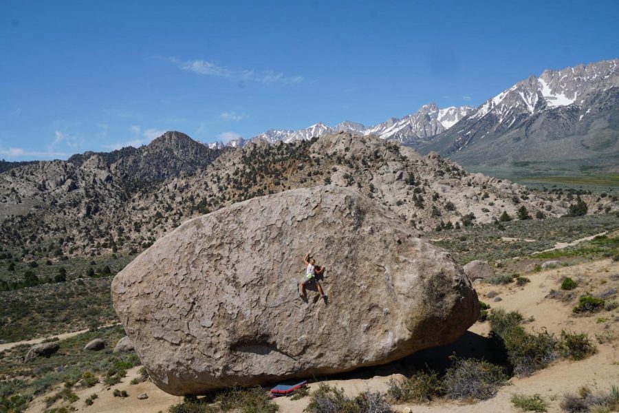 Zach Steiner scales a boulder in Waco Tanks, in El Paso Texas. “[Waco Tanks} is a group of huge rock structures and they’re situated all around the desert".