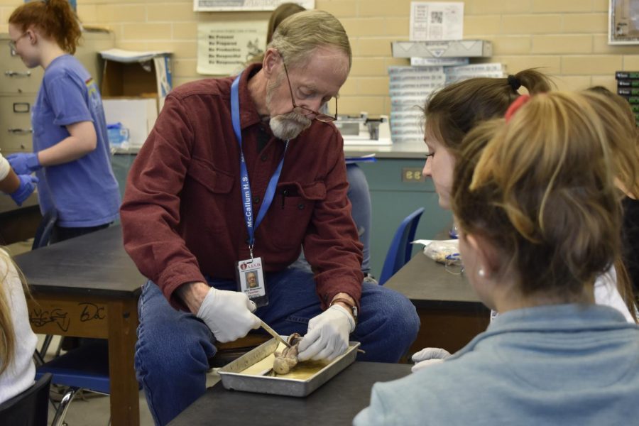 Whisennand helps students with their rat dissections in his Anatomy and Physiology class. They have to know that you care for them,” Whisennand said. “If they know you care for them, they don’t mind working for you.