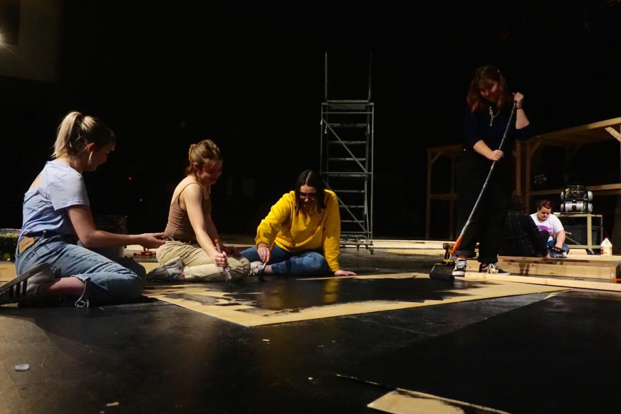 IN PREPARATION: Seniors Persephone Harris, Georgia Boutot, Zoe Hocker and junior Stella Shenkman paint a series of set pieces for the upcoming spring musical 42nd Street. The tech crew has been putting in long hours and hard work since late October. The production is one of the most challenging and tech-heavy shows MacTheatre has ever endeavored to stage. 42nd Street premieres on Jan. 31 at 7 p.m. and runs through Feb. 10. Tickets and alternate show times can be found at mccallum.ludus.com. Photo by Caleb Melville.