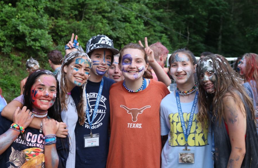Freshman Annabel Winter and her friends from YMCA High Harbour, a camp in Georgia, pose for a picture during a de-stressing Friday at camp; the day’s activities included painting each others’ faces and throwing flour and shaving cream at each other.  Winter is a CIT this year.
