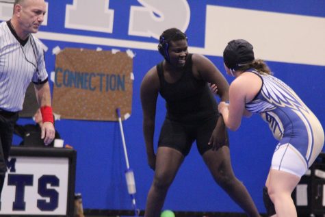 Tracy Atoo (Left) wrestles against an opponent from Akins high school on Nov. 14 in the team’s tri-meet with Akins and Anderson. Atoo is trying wrestling for the first year this season. 
