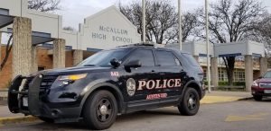 An AISD police car was parked outside of the front entrance of McCallum on Feb. 14 after terroristic threats from the previous days. AISD police sent extra officers to campus on Valentines Day out of an abundance of caution, Garrison said.
