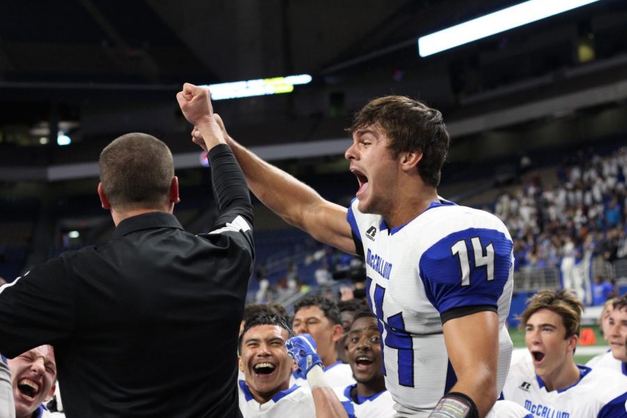 After McCallum beat Calallen, 20-7, to make it to the fifth round of playoffs, senior Max Perez and Coach Thomas Gammerdinger celebrate the historic win. “The feeling of winning this game is indescribable,” Perez said. “Calallen is a really good team and that win just proved to us we were just as good and better. It really showed how much our hard work paid off, and I couldn’t be happier.” This image was part of Madisons yearbook photo portfolio that won a First Place 2019 CSPA Gold Circle Award. Gregory James online story about the game also won a first place Gold Circle Award. Photo by Madison Olsen.