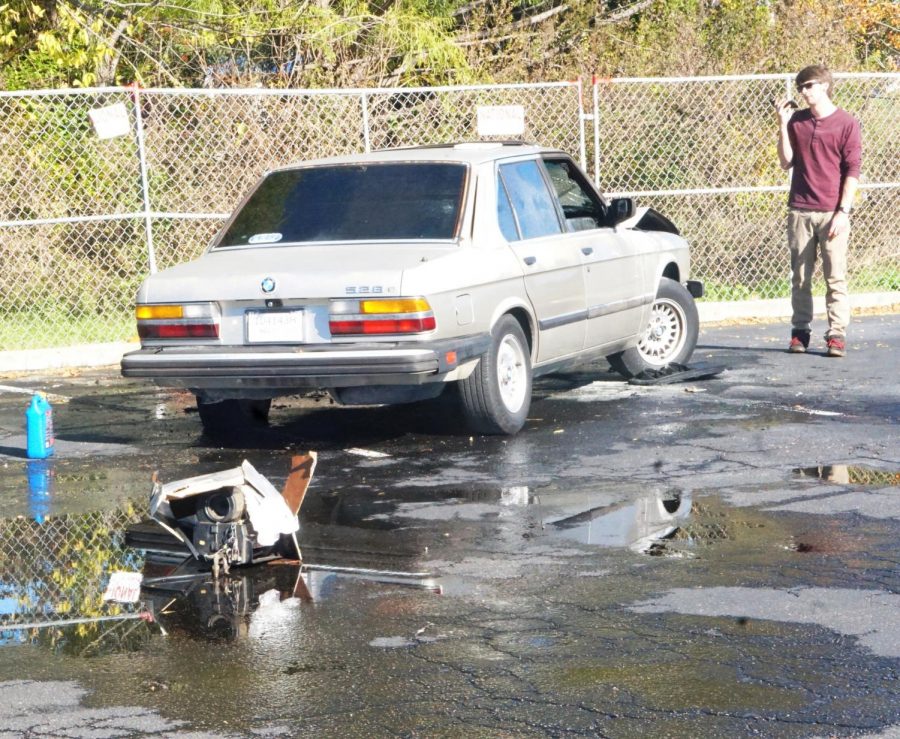 BACKFIRE SPARKS CAR FIRE: Just after 1 p.m. today, neighborhood resident Adam Rice was working on his car in the Dart Bowl parking lot. The car had backfired before, but when the hood started smoking, he knew he had to get out of the vehicle. When he opened the hood to examine the cause of the smoke, flames erupted from underneath. Rice tried to extinguish them with a towel, but the fire continued to reignite. His fuel line melted and caught fire, spraying gas everywhere. He immediately closed the hood and called the fire department. A bystander helped him put out most of the fire with an extinguisher, but unfortunately, it spread to the interior. Soon afterwards, the whole car went up in flames. It sucked. was all Rice had to say about the event. Eventually, the fire department arrived to put out the fire, but Rice, who was trying to fix his car for a long time, thinks that he will have to start back at square one.