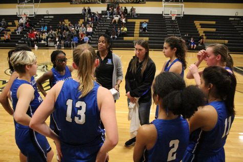 Coach Campbell rallies the troops during a timeout at Lanier, Photo by Selena De Jesus.