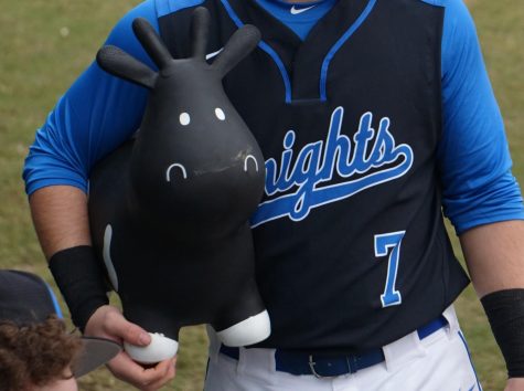 At the 2019 Alumni Baseball Game, rally captain Noah Cooley brought Ralphie out of the dugout to change the moo-mentum after the alums put up three runs in the top of the first. Ralphie went right to work, and before Harry Caray could say, Holy cow! the varsity led, 8-3. Photo by Dave Winter.