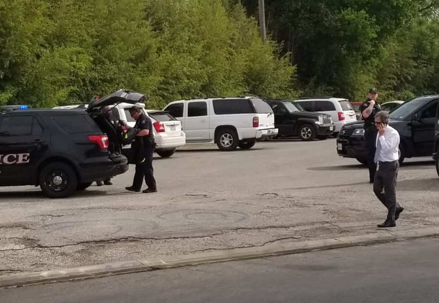 AISD police and school administrators converge on the senior parking lot where the detained main was questioned and later released. He possessed a concealed weapons permit and, according to police, had committed no crime.