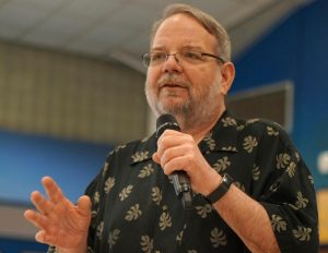 Michael Urick speaks to the faculty at his retirement luncheon on May 29. Urick passed away this March. He taught English at McCallum for more than 30 years. His obituary post elicited a long list of fond memories from his former students and colleagues.