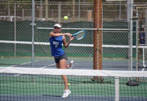 Freshman Peyton Casey hits the ball to her opponents during her and Williams’ match against Dripping Springs.